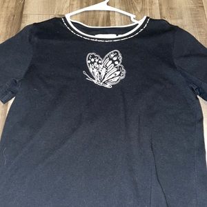 Black shirt with a butterfly on the front, size petite small.